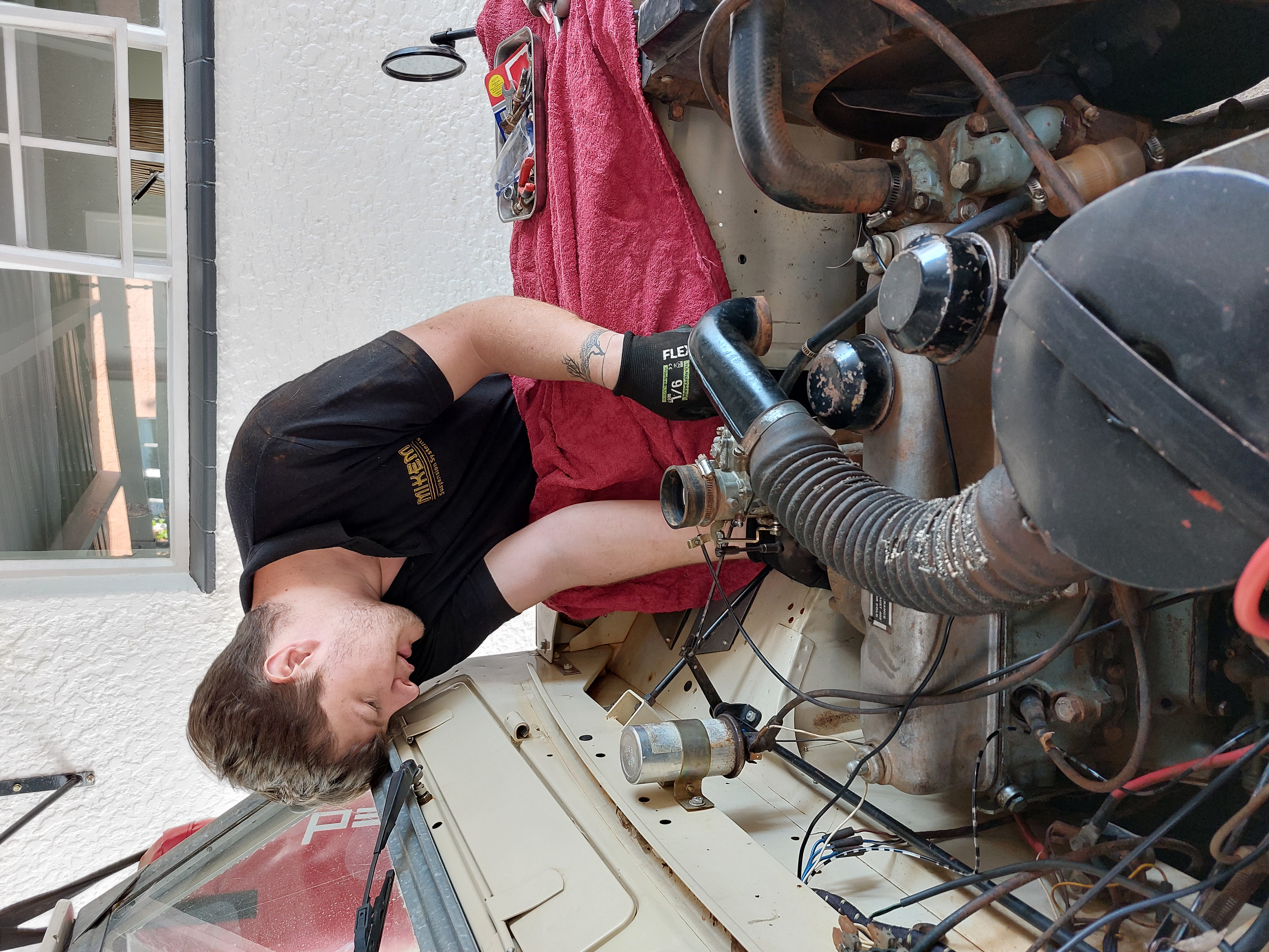 Mechanic working on car engine